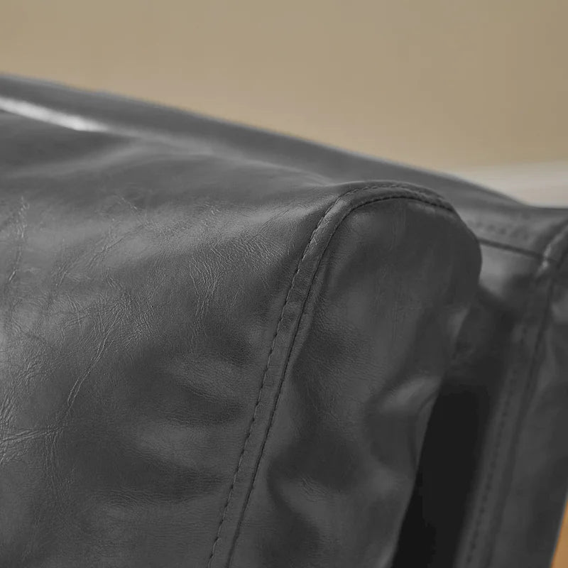 Sillón tapizado en PU con estructura de acero