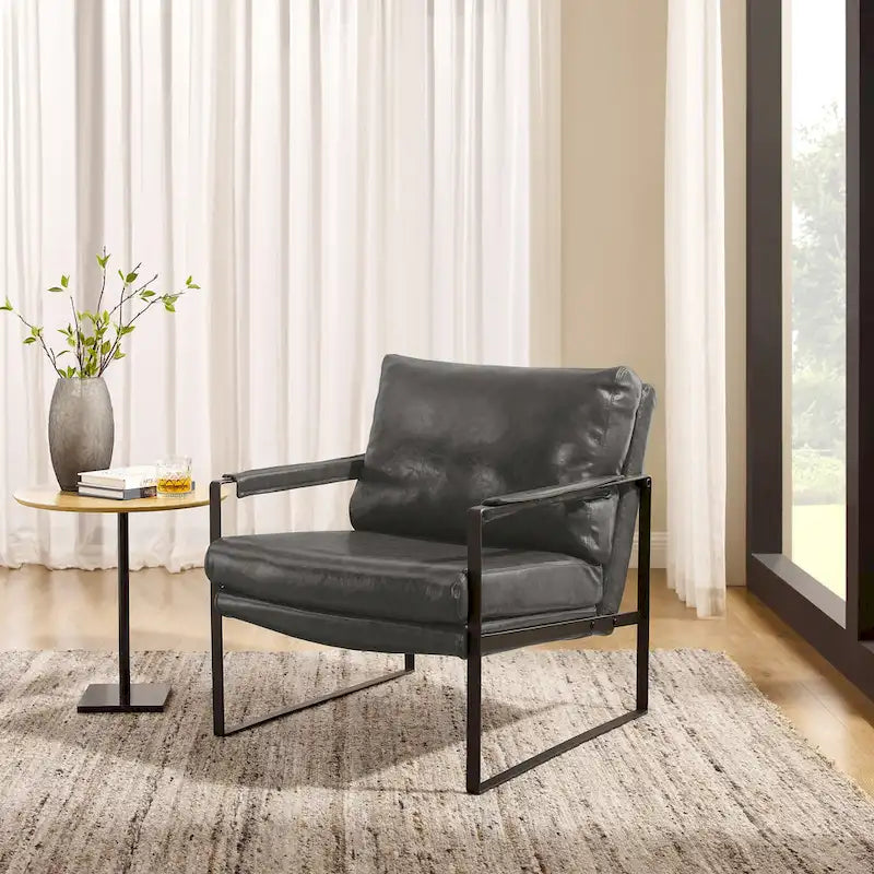 Sillón tapizado en PU con estructura de acero