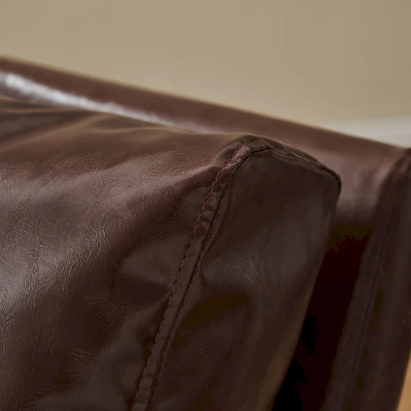 Sillón tapizado en PU con estructura de acero