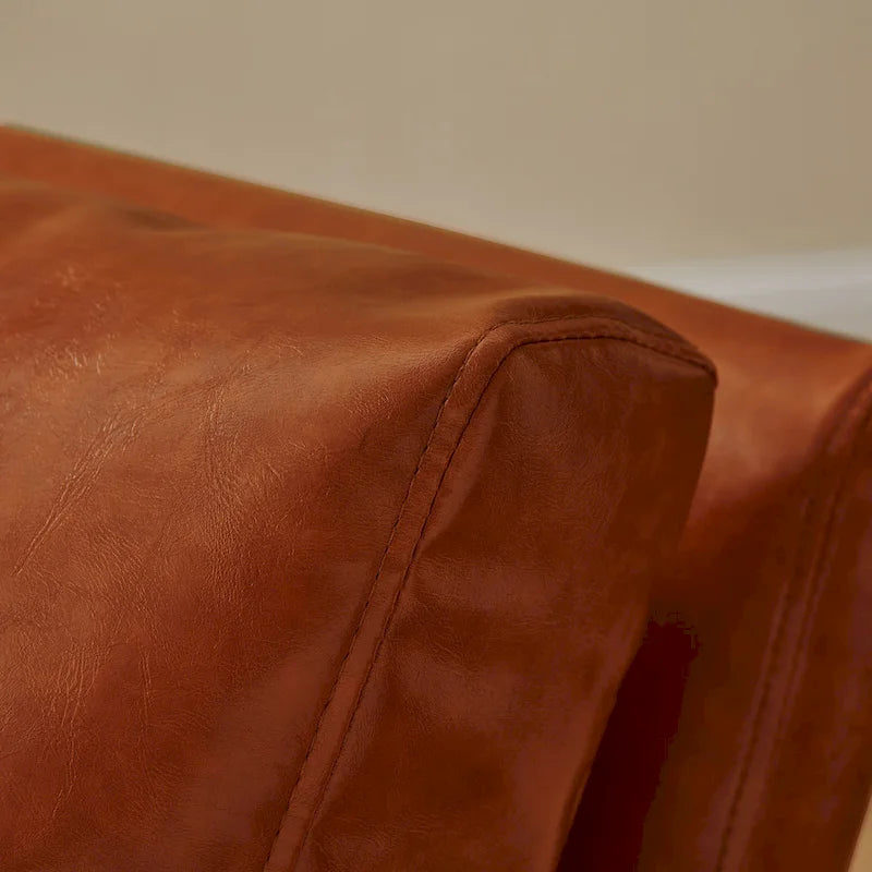 Sillón tapizado en PU con estructura de acero