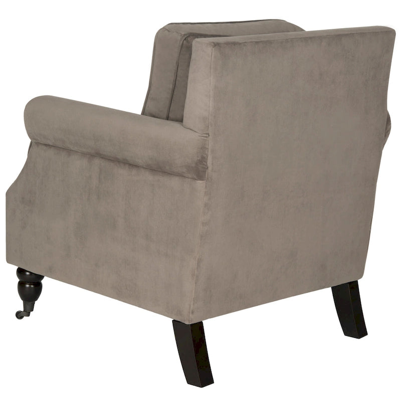 Sillón club clásico con reposabrazos enrollados y tachuelas