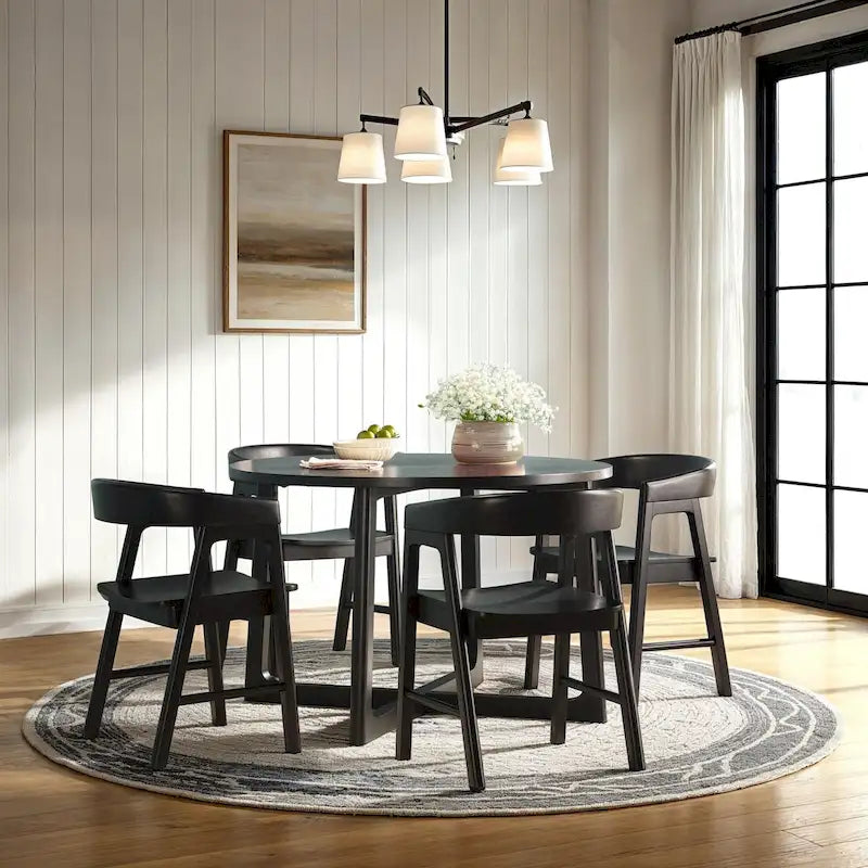 Mesa de comedor redonda de madera maciza con patas geométricas